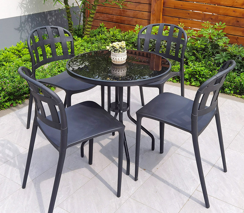 Black plastic stacking chairs and table set of 4