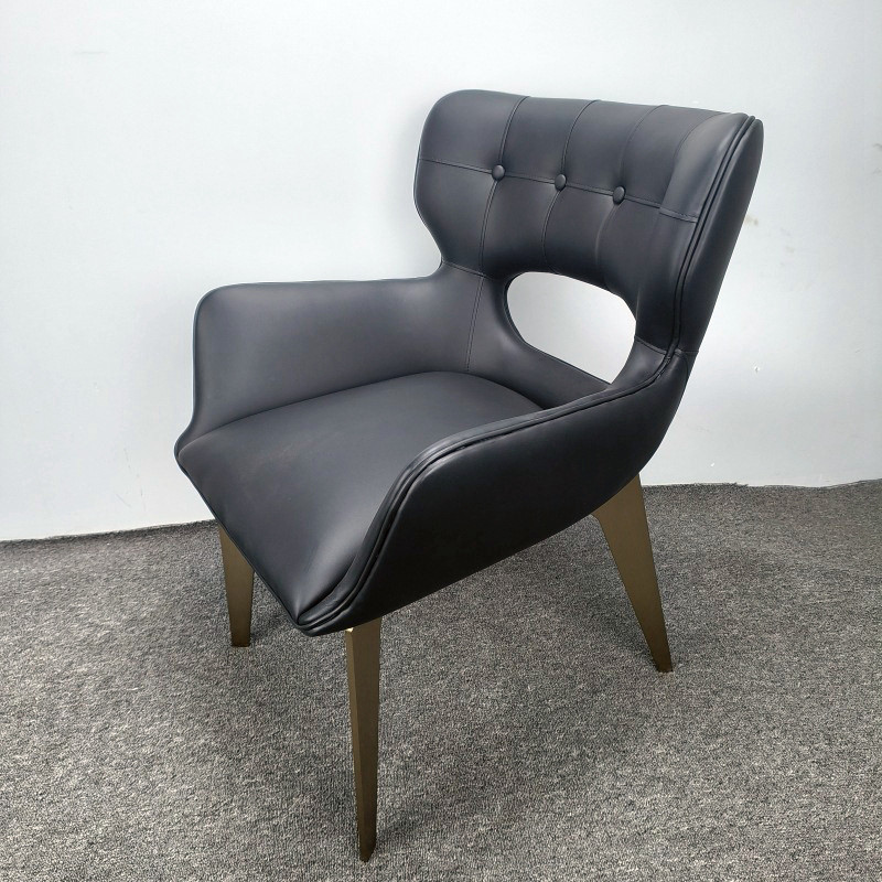 Tufted Black Leather Dining Chair With Arms And Gold Legs
